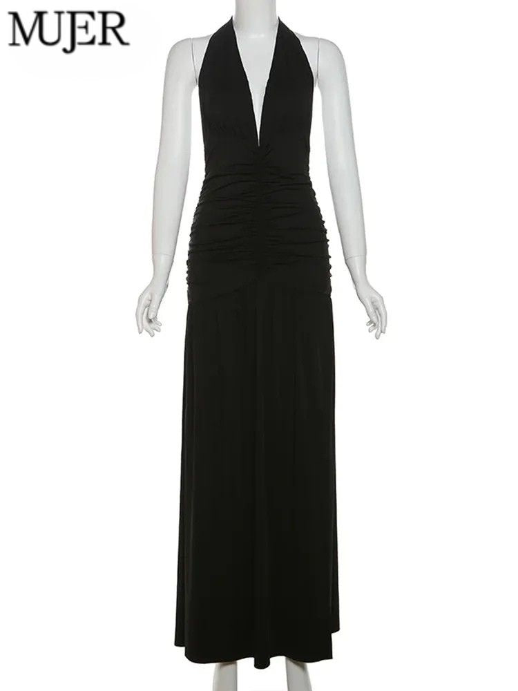 Black halter neck dress on a mannequin with 'MUJER' branding.