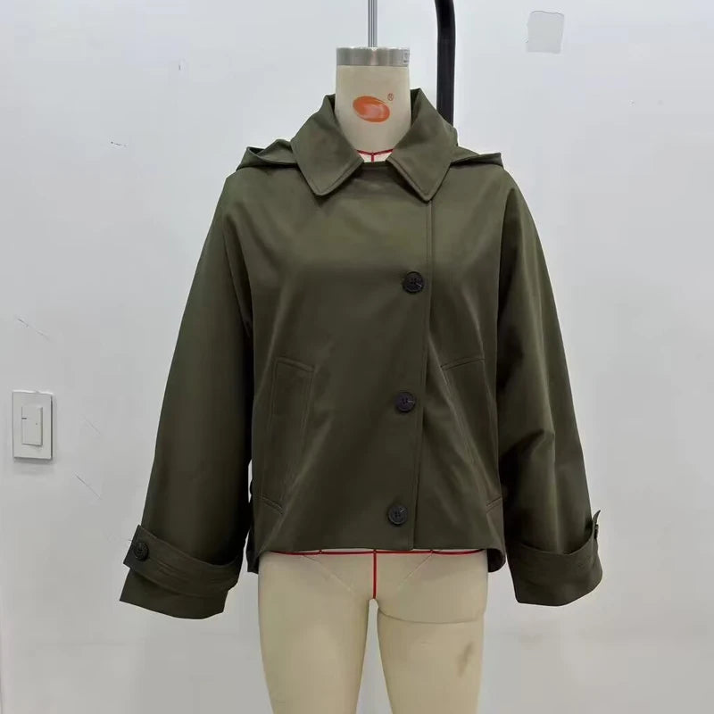 Green jacket on a mannequin against a white background