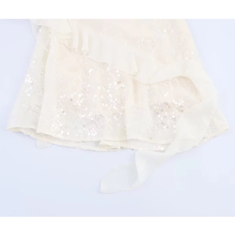 White lace top on a light blue background