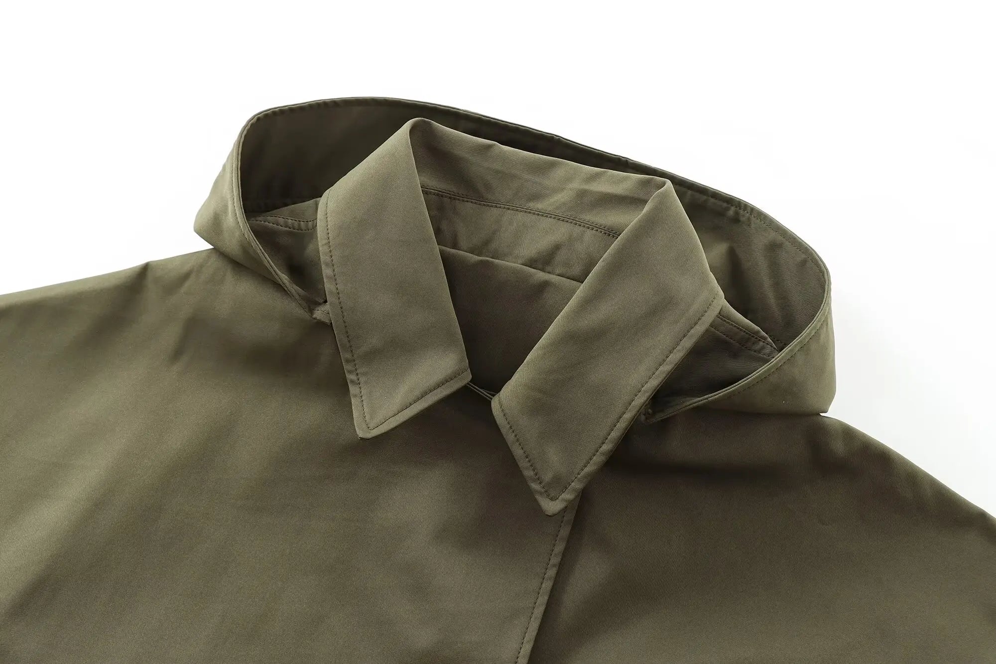 Close-up of a green jacket with a collar on a white background