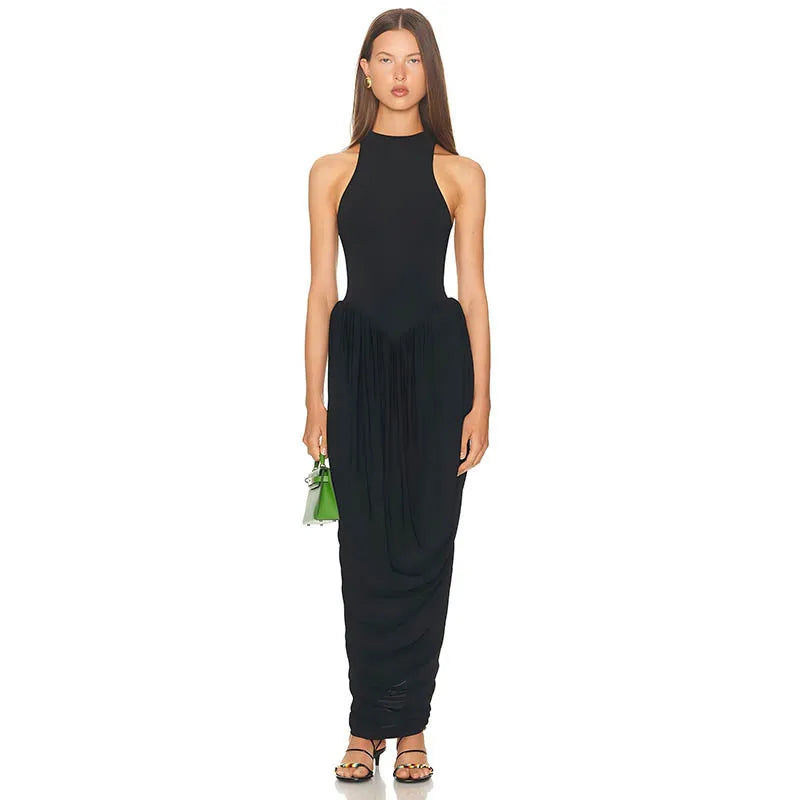 Woman wearing a black sleeveless dress on a white background