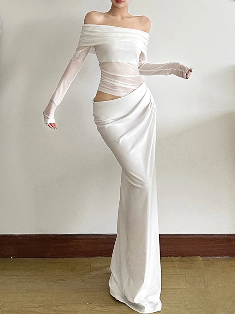 White off-shoulder dress with long sleeves on a plain background