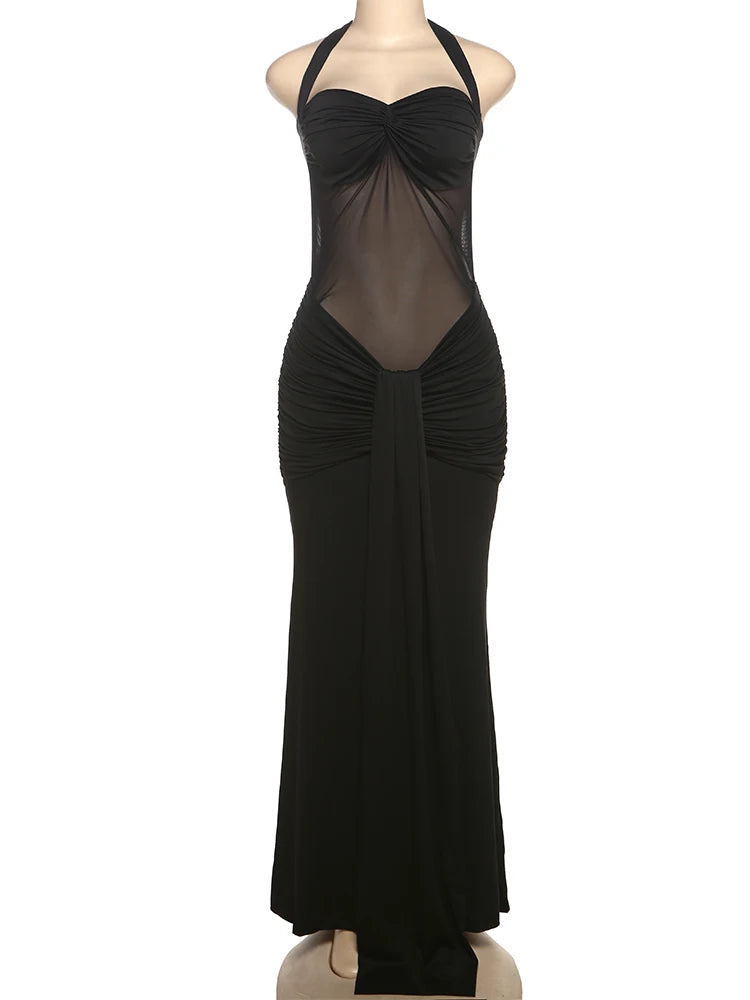 Black evening gown on a mannequin against a white background